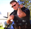 Policeman administering Bio Med Wash